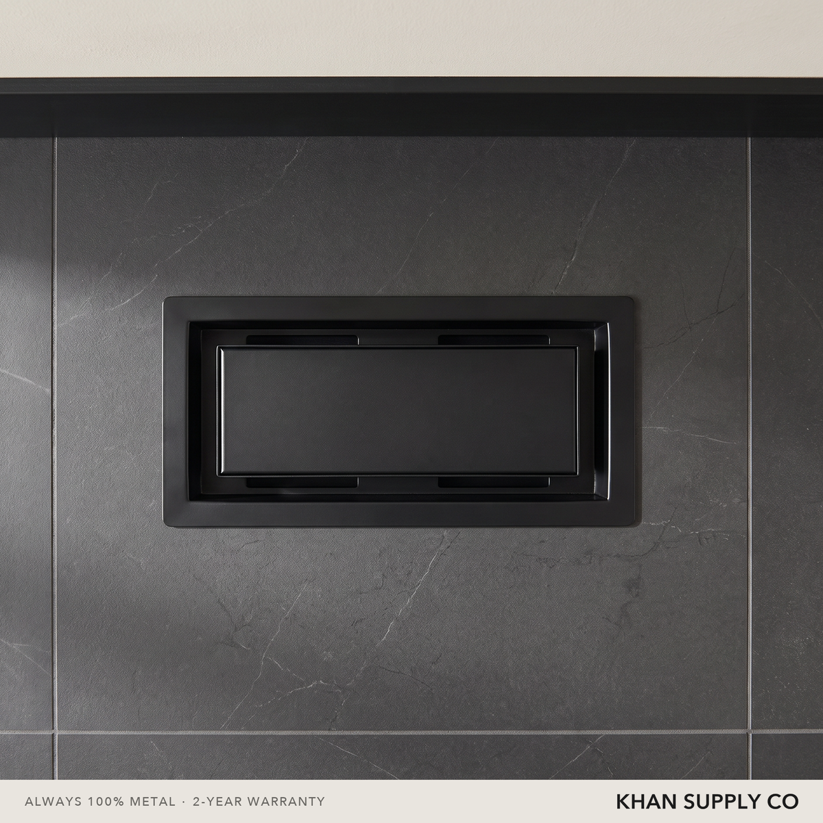 Upgraded 2-in-1 drop-in vent installed in a dark stone-tiled washroom wall — Khan Supply CO