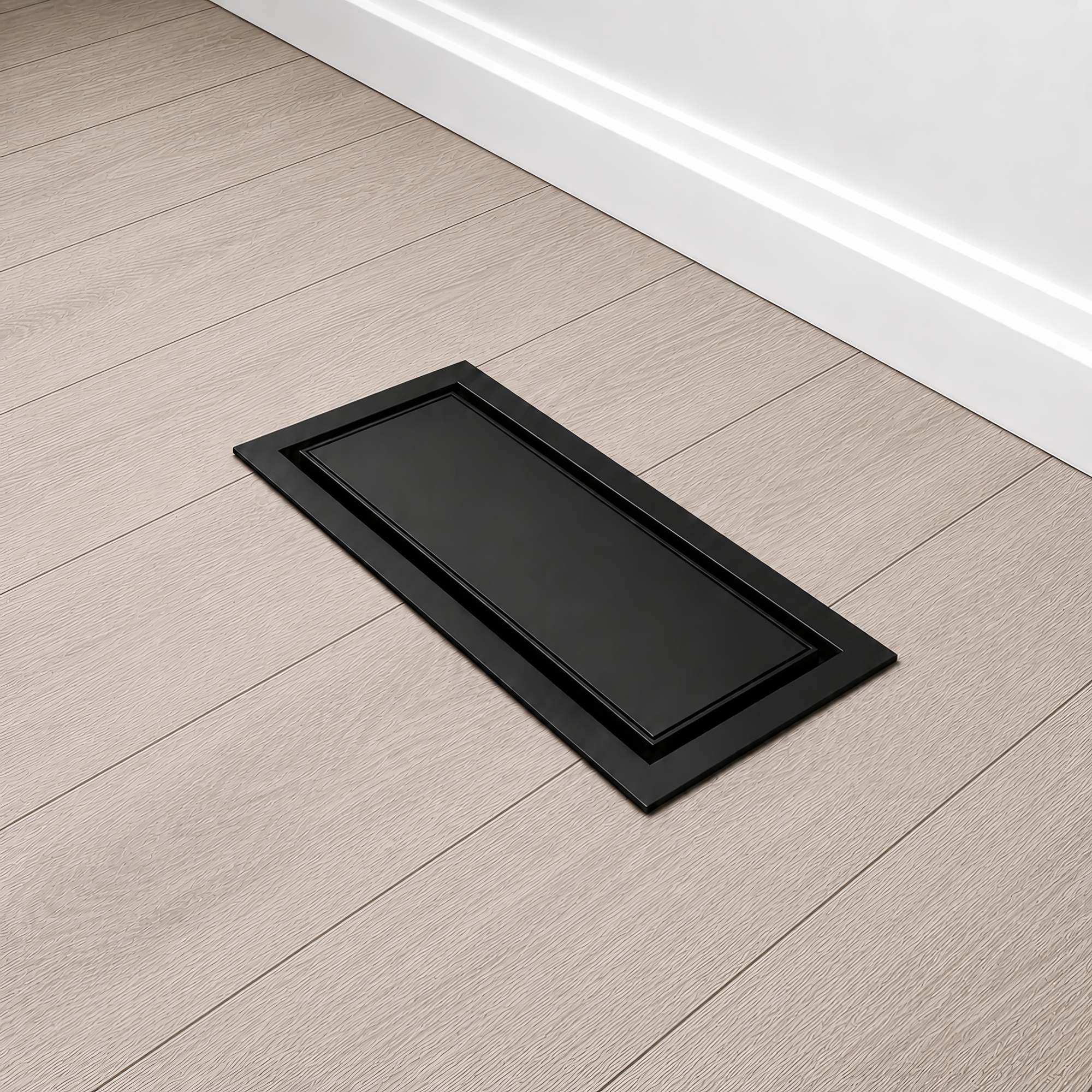 Matte black metal drop-in floor vent with a floor-matching insert installed in a kitchen floor