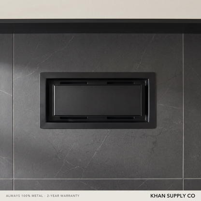 Upgraded 2-in-1 drop-in vent installed in a dark stone-tiled washroom wall — Khan Supply CO